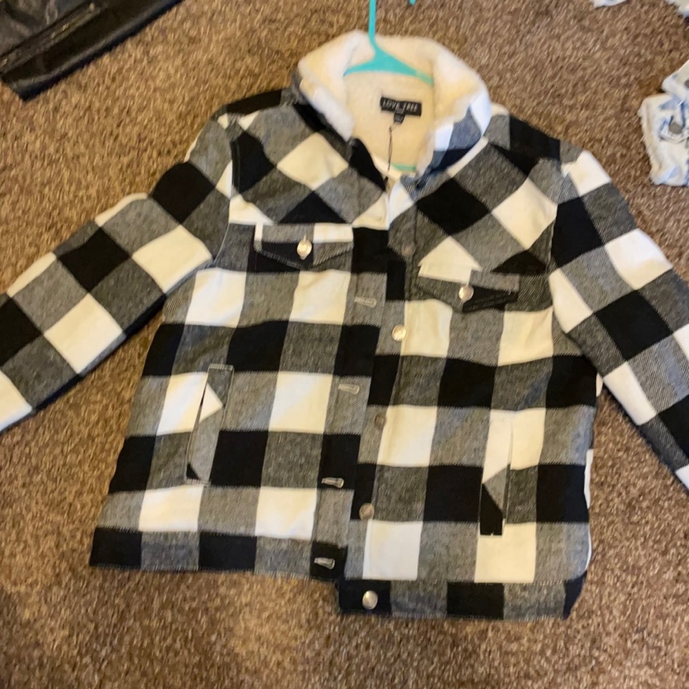 This is a faux fur jacket black n white jacket